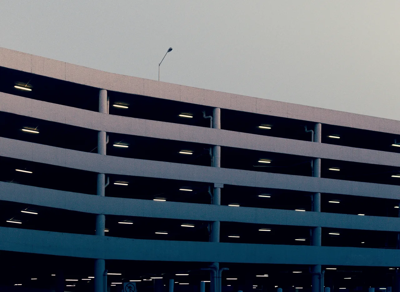Gray building parking lot