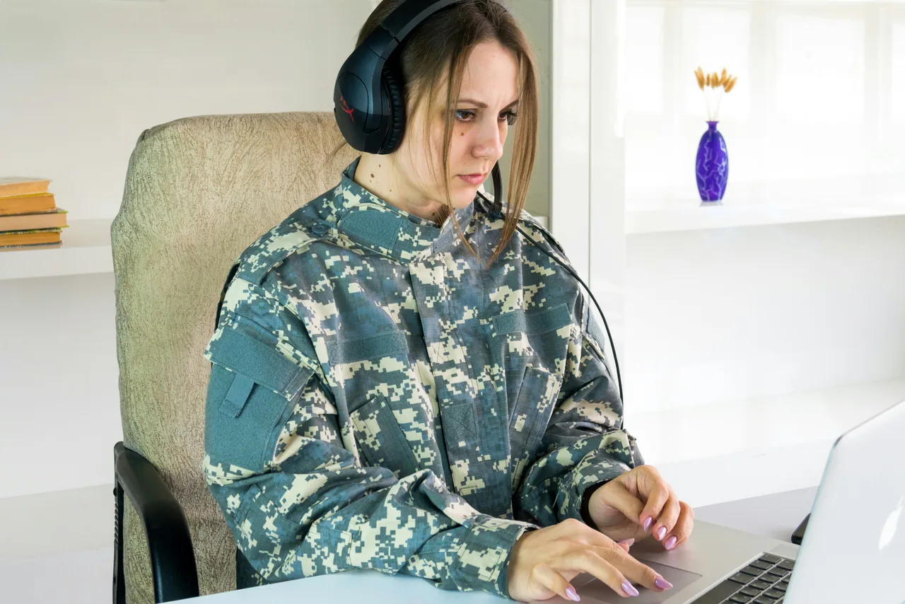 Attentive female soldier student working on laptop pc. More of my photos and videos Adobe Stock:http://bit.ly/3RqlciK More of my photos and videos Shutterstock: https://www.shutterstock.com/g/ALEKSANDRBERDYUGIN My email: bermix999@gmail.com